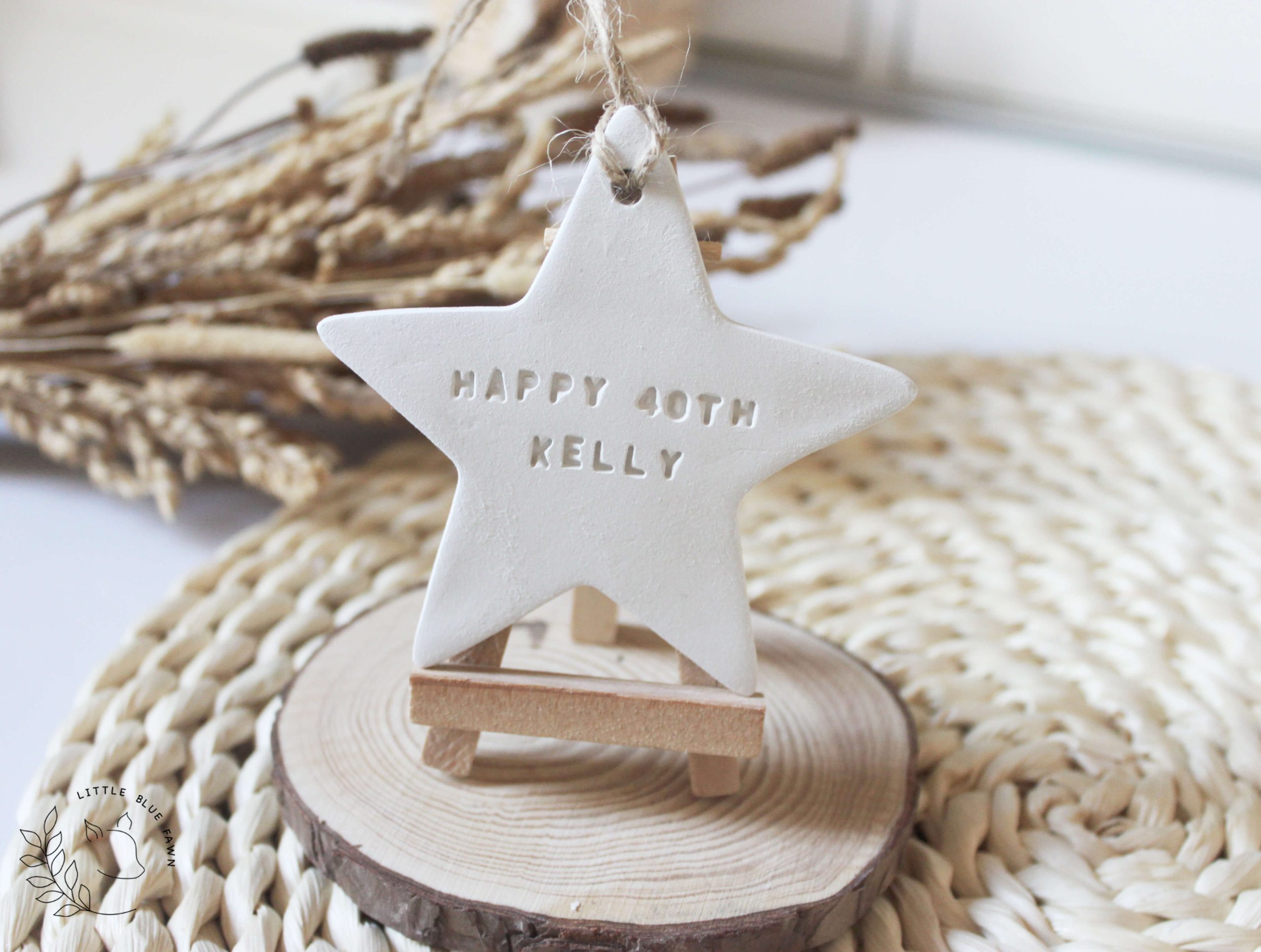 Personalised Happy Birthday star keepsake handmade from clay and customised with a name and age. A thoughtful birthday gift and lasting memory.