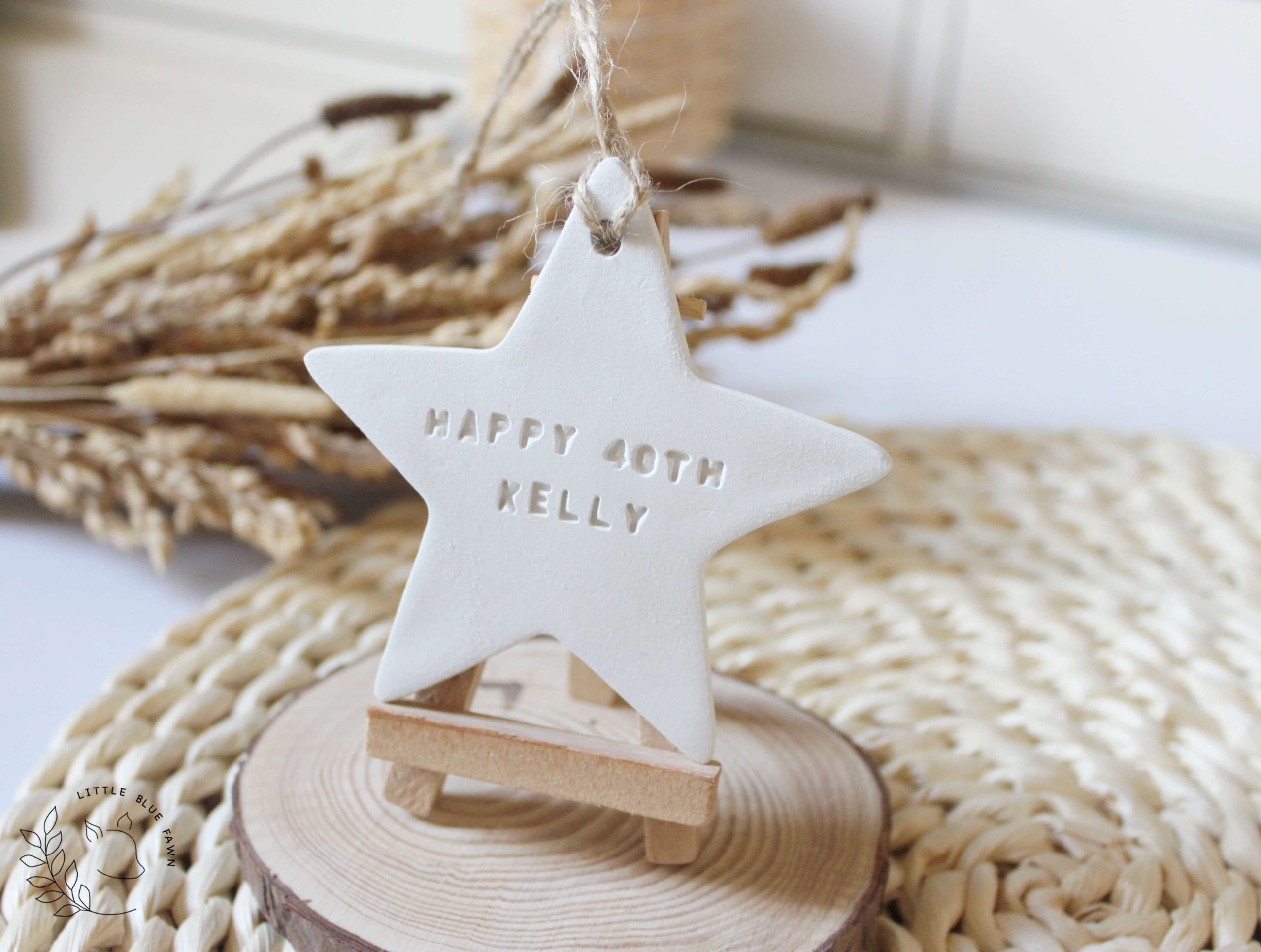 Personalised Happy Birthday star keepsake handmade from clay and customised with a name and age. A thoughtful birthday gift and lasting memory.